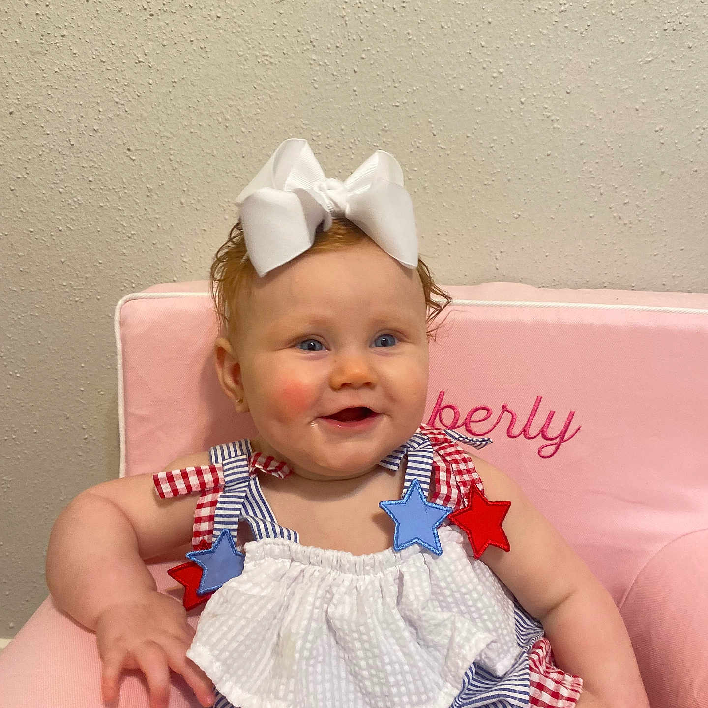 Emberly is registered to the contest to win money with this photo: accessories, baby, chair, clothing, costume, couch, cushion, dress, face, furniture, happy, hat, head, homedecor, jewelry, necklace, person, photography, portrait, sitting