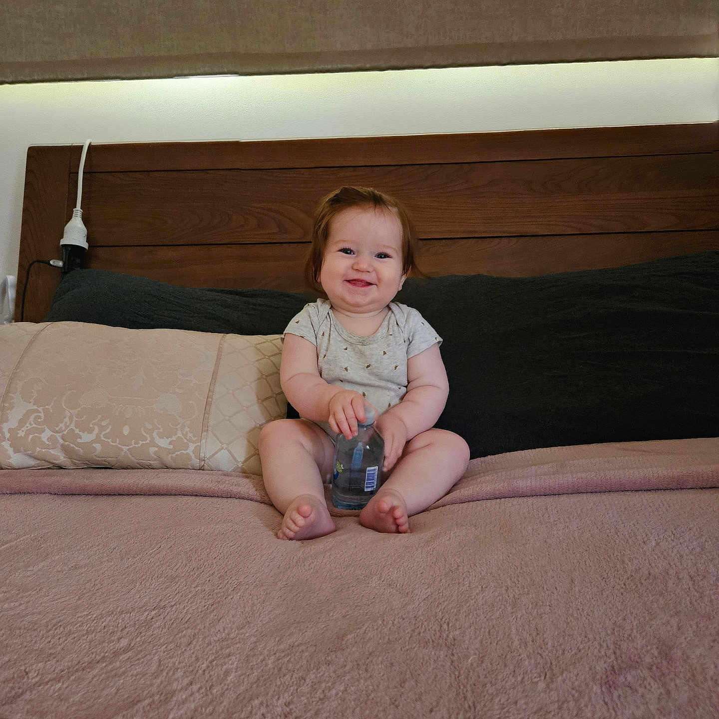 Elexia is registered to the contest to win money with this photo: baby, bed, bedroom, bodypart, clothing, couch, cushion, face, finger, furniture, hand, head, homedecor, indoors, pants, person, photography, portrait, room, sitting