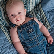 Cooper joined the competition — help win amazing prizes! baby, infant, denim_overalls, blue_quilt, bed, lying_down, child, cute, soft_lighting, portrait, face, skin, hand, clothing, fabric, baby_fashion, casual, indoor, newborn, young_child