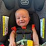 Creed joined the competition — help win amazing prizes! baby, car_seat, smile, child, infant, seatbelt, toy, blanket, colorful, happy, cute, person, clothing, head, arm, indoor, safety, closeup, baby_toy, infant_girl