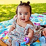 Jasmine joined the competition — help win amazing prizes! baby, child, smiling, outdoor, grass, towel, toy, colorful, sunlight, dress, footwear, person, happy, sitting, cute, nature, playful, summer, park, portrait