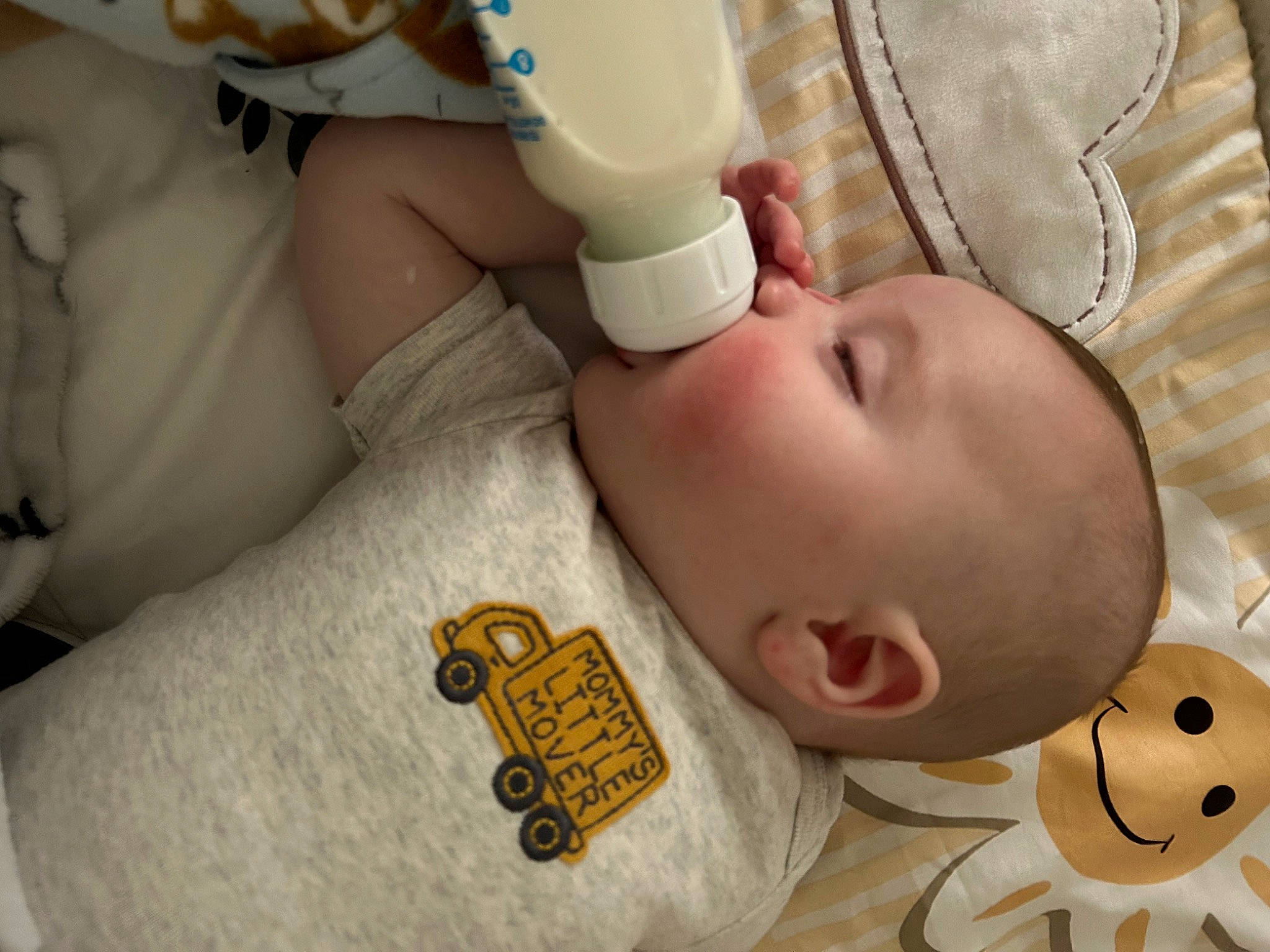 Baylor is registered to the contest to win money with this photo: arm, baby, baby_sleeping, baby_toddler_clothing, cheek, child, comfort, drinkware, ear, eyelash, finger, head, mouth, nail, nose, person, product, skin, thumb, toddler