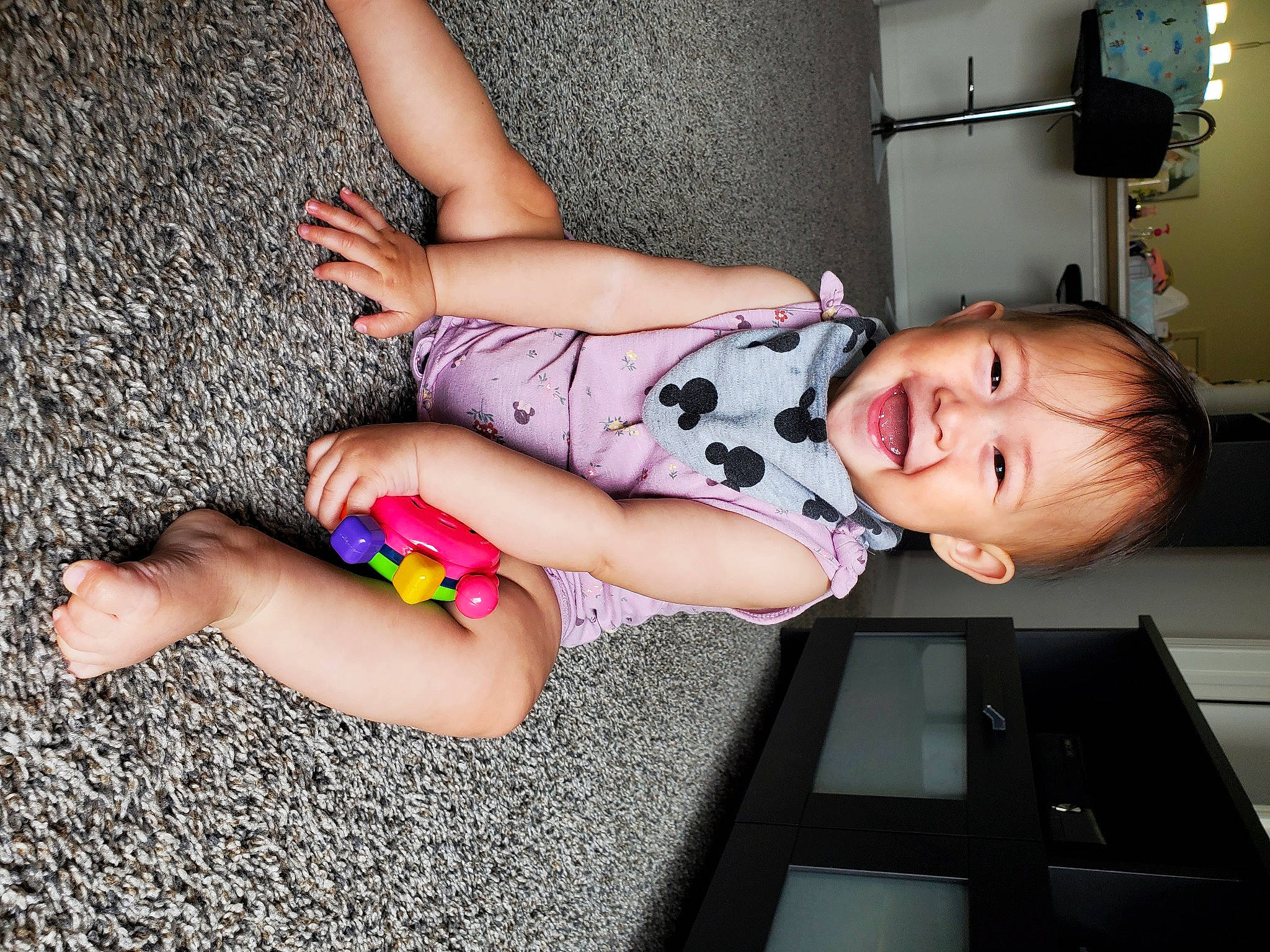 Halle joined the competition — help win amazing prizes! baby, baby_toddler_clothing, calf, dress, elbow, finger, flooring, foot, fun, human_leg, joint, joy, knee, leg, person, sitting, smile, thigh, toddler, trunk