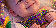 William joined the competition — help win amazing prizes! baby, towel, mardi_gras, jester_hat, mask, beads, confetti, celebration, smile, festive, purple, green, gold, feathers, crown, happy, portrait, child, colorful, party