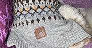 Pax is registered to the contest to win money with this photo: animal, blanket, comfort, cozy, dog, domestic_animal, ears, fur, indoor, knitwear, pattern, pet, purple_blanket, resting, sleeping, snuggled, soft, sweater, textile, warm