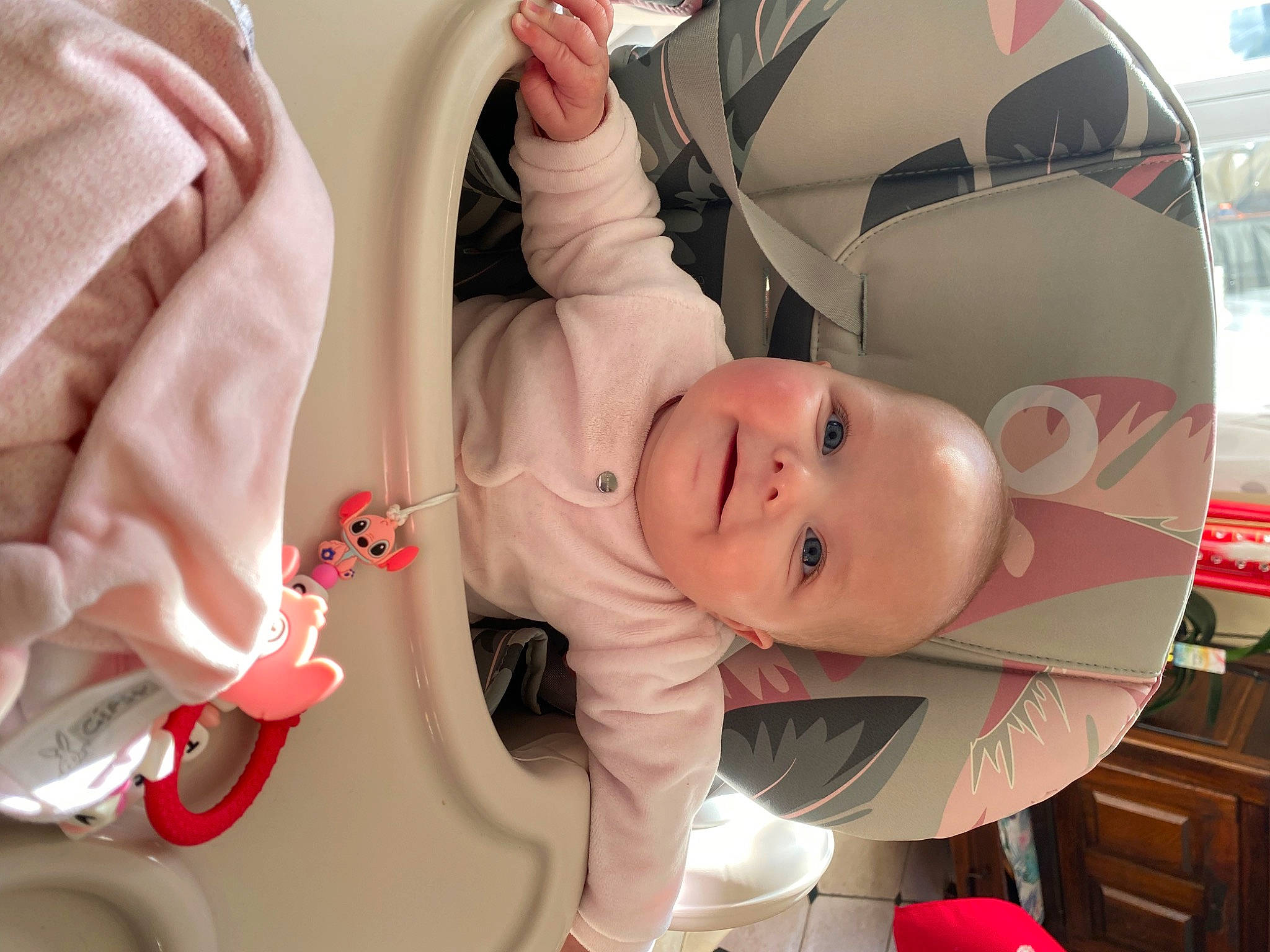 Calista participe au concours pour gagner de l'argent avec cette photo : baby, baby_carriage, baby_products, baby_safety, baby_toddler_clothing, cabinetry, cheek, child, comfort, facial_expression, gesture, joy, mouth, person, pink, red, service, skin, sleeve, smile