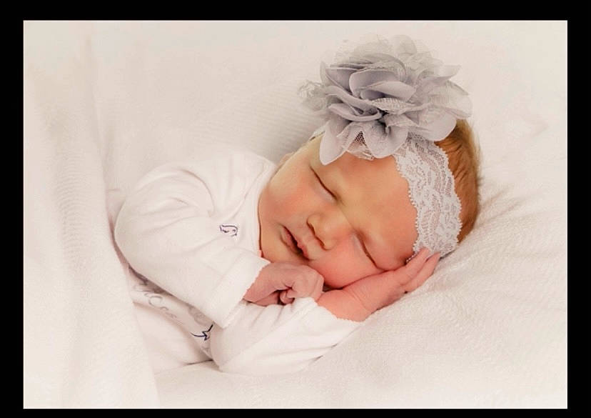 Harper joined the competition — help win amazing prizes! baby, baby_sleeping, baby_toddler_clothing, bedding, bedtime, cap, comfort, eyelash, fashion_accessory, font, happy, headband, headpiece, headwear, knit_cap, linens, pattern, person, petal, picture_frame