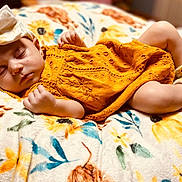Ellie is registered to the contest to win money with this photo: baby, sleeping, dress, headband, bow, blanket, floral, socks, infant, cute, peaceful, cozy, portrait, child, resting, soft, warm, indoors, toddler, relaxation