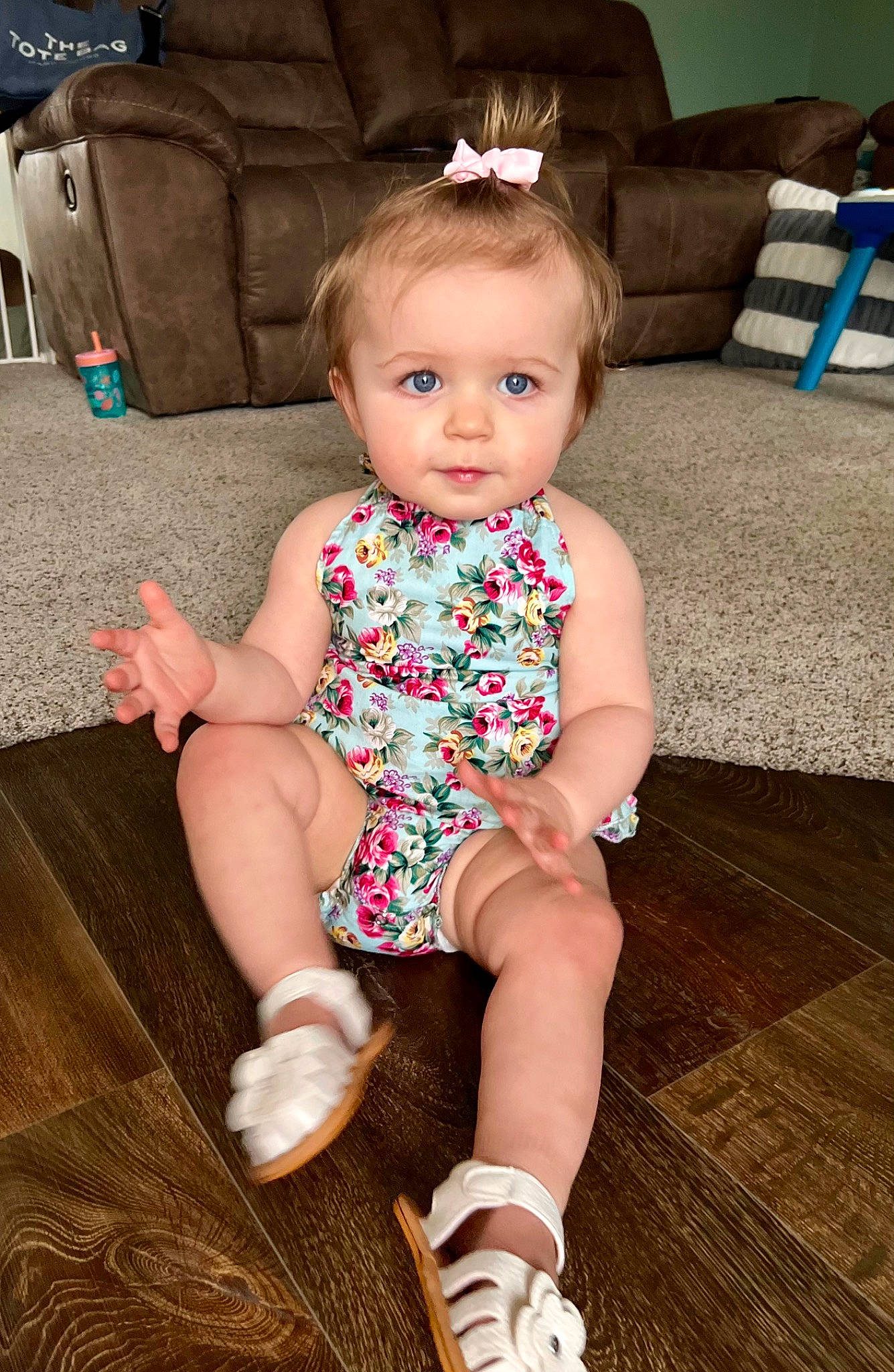 Carmella joined the competition — help win amazing prizes! baby, baby_toddler_clothing, blue, cheek, child, couch, eye, face, floor, flooring, hardwood, head, iris, knee, living_room, person, skin, smile, thigh, toddler