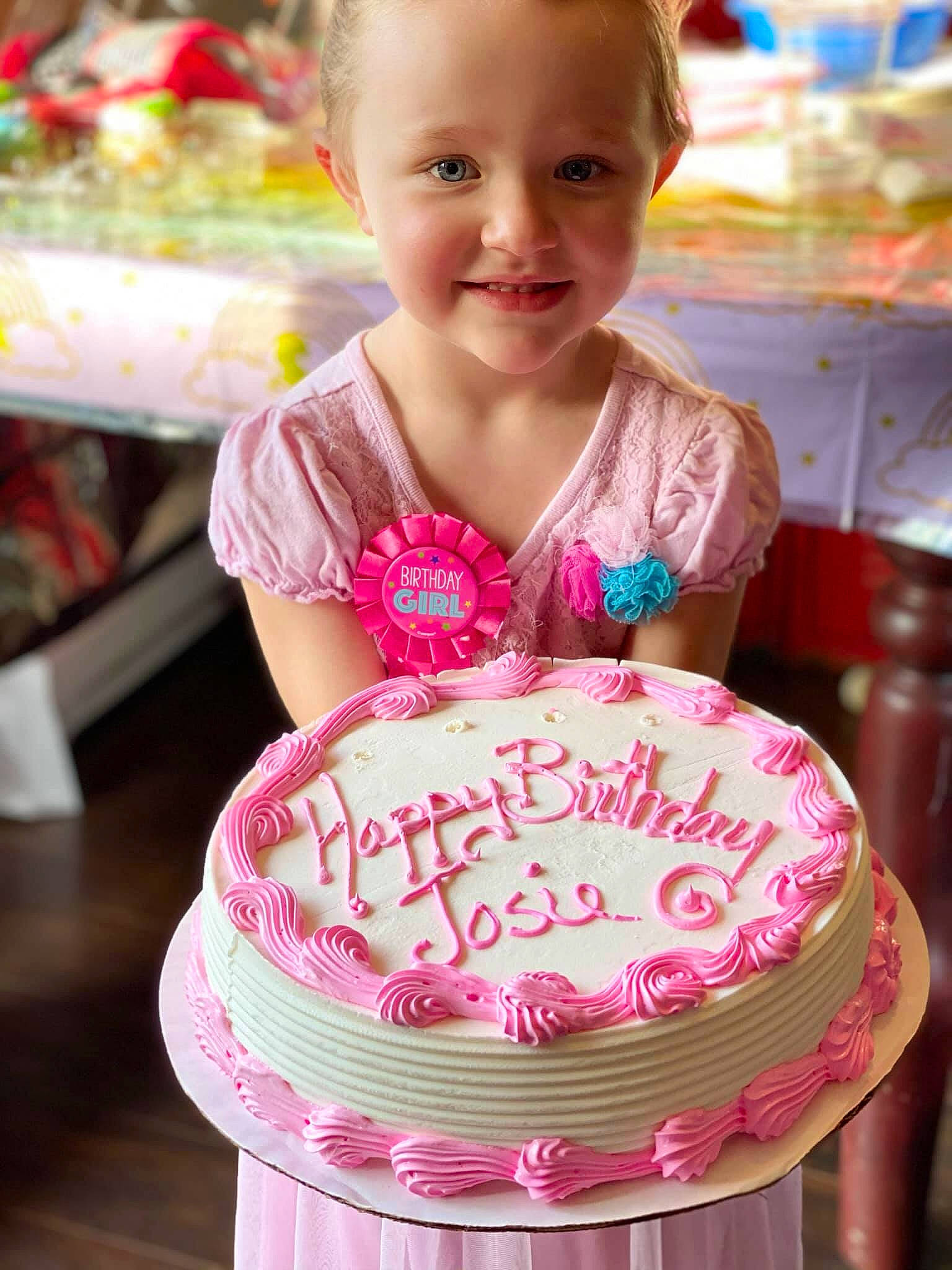 Josie is registered to the contest to win money with this photo: baby_toddler_clothing, baked_goods, beauty, birthday_cake, birthday_party, cake, cake_decorating, cake_decorating_supply, child, dessert, dress, event, food, happy, joy, person, pink, smile, sugar_cake, sugar_paste