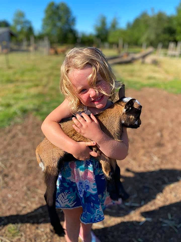 Josie joined the competition — help win amazing prizes! eyewear, fawn, fun, grass, grassland, happy, joy, landscape, leisure, mammal, meadow, people_in_nature, person, plant, recreation, rural_area, sky, summer, sunglasses, toddler