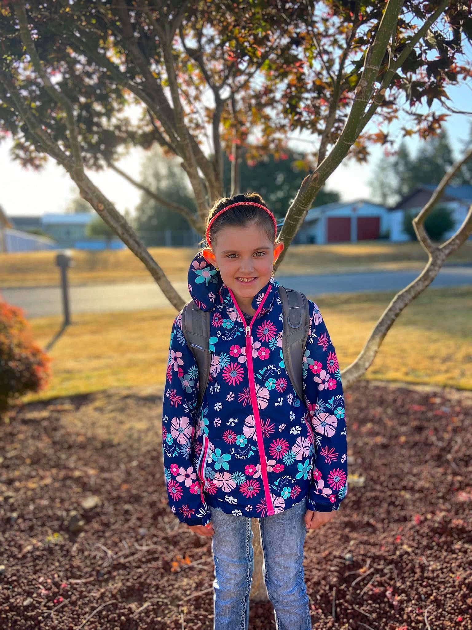 Hannah is registered to the contest to win money with this photo: branch, denim, electric_blue, grass, happy, headwear, jacket, jeans, joy, leisure, people_in_nature, person, plant, playground, recreation, sleeve, street_fashion, sunlight, swing, tints_and_shades