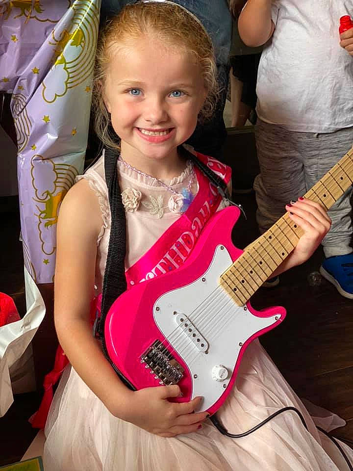 Macy is registered to the contest to win money with this photo: dress, event, fun, guitar, guitar_accessory, guitarist, happy, joy, magenta, music, musical_instrument, musical_instrument_accessory, musician, person, photograph, pink, plucked_string_instruments, smile, string_instrument, string_instrument_accessory