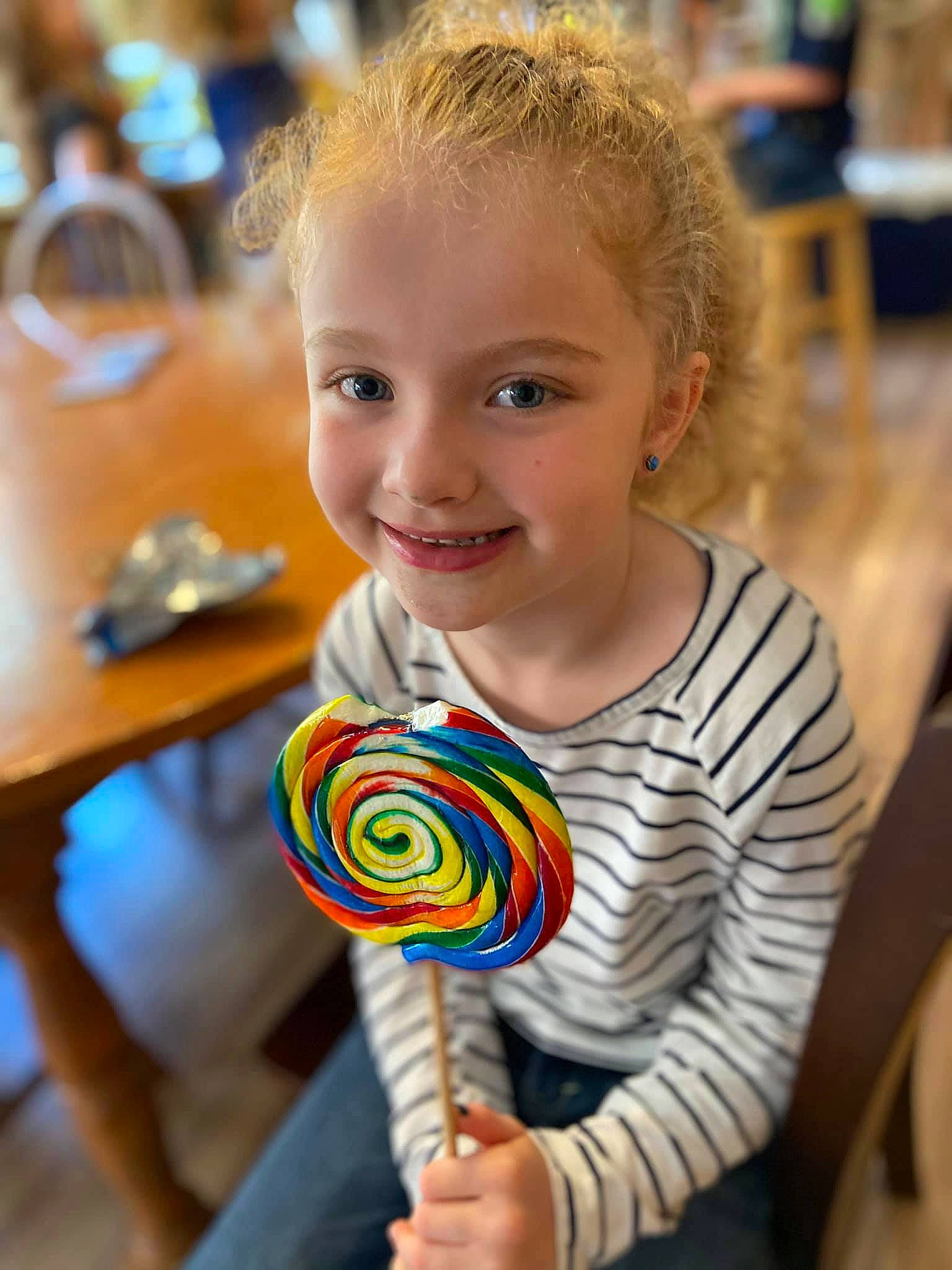 Macy is registered to the contest to win money with this photo: automotive_wheel_system, candy, child, confectionery, dessert, event, food, fun, happy, hard_candy, joy, leisure, lollipop, party_supply, person, play, smile, stick_candy, sweetness, t_shirt