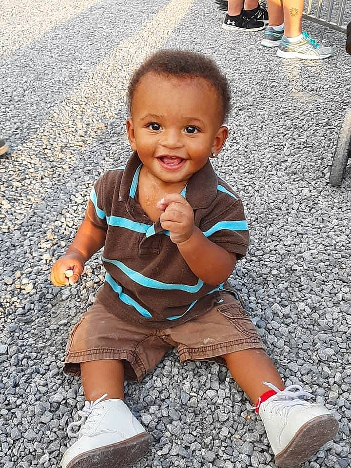 Trevelle joined the competition — help win amazing prizes! baby_toddler_clothing, black, eye, face, facial_expression, footwear, green, happy, head, human, joint, joy, leg, person, photograph, shoe, shorts, skin, sleeve, smile