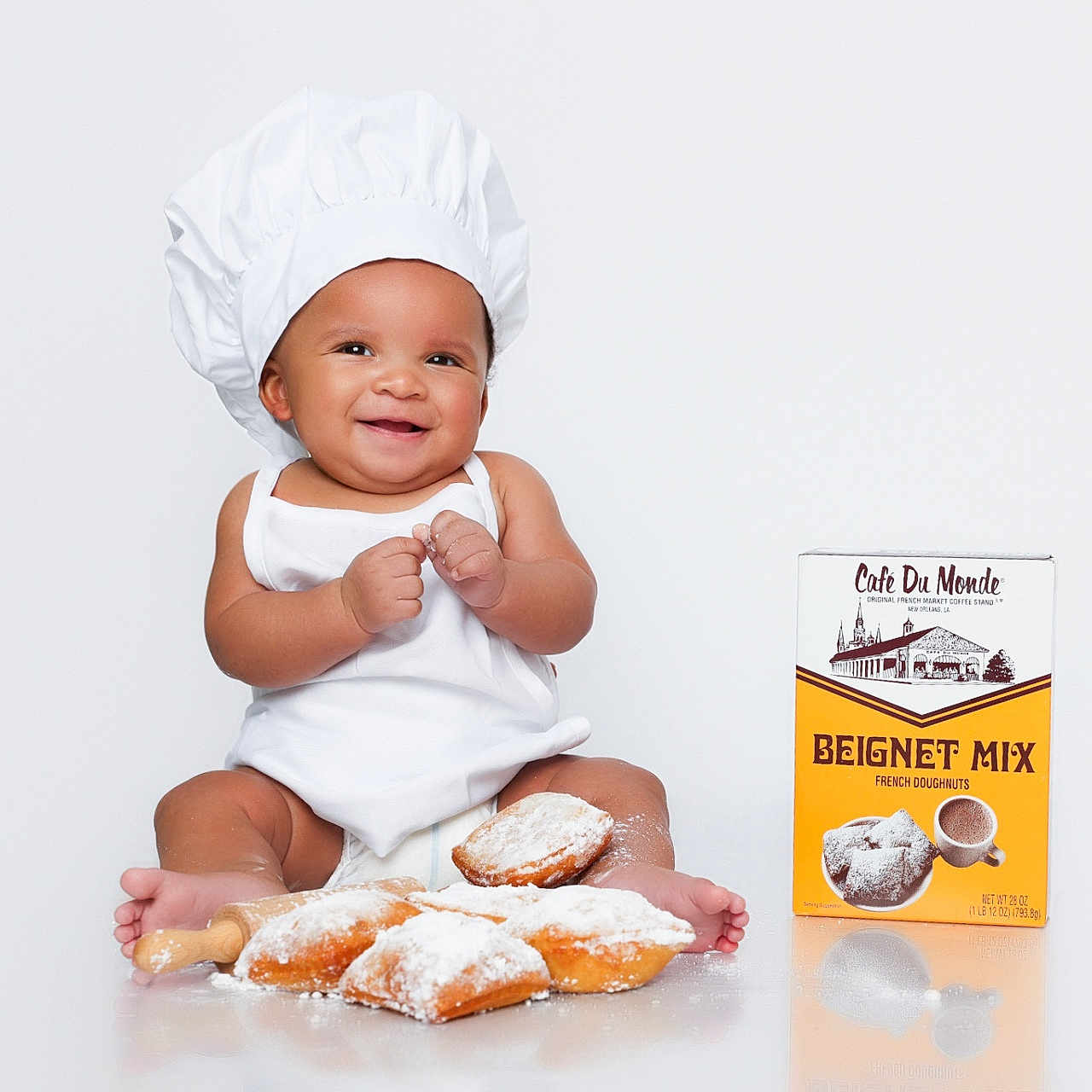 Kaezhon is registered to the contest to win money with this photo: baby, bodypart, bonnet, bread, bun, cap, clothing, cup, dessert, face, finger, food, hand, hat, head, pastry, person, photography, portrait, sweets
