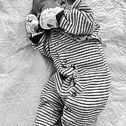 Braiden joined the competition — help win amazing prizes! baby, newborn, sleeping, striped_clothing, onesie, blanket, quilted, infant, cute, peaceful, resting, soft, child, portrait, monochrome, black_and_white, small, wrapped, hand_mittens, lying_down