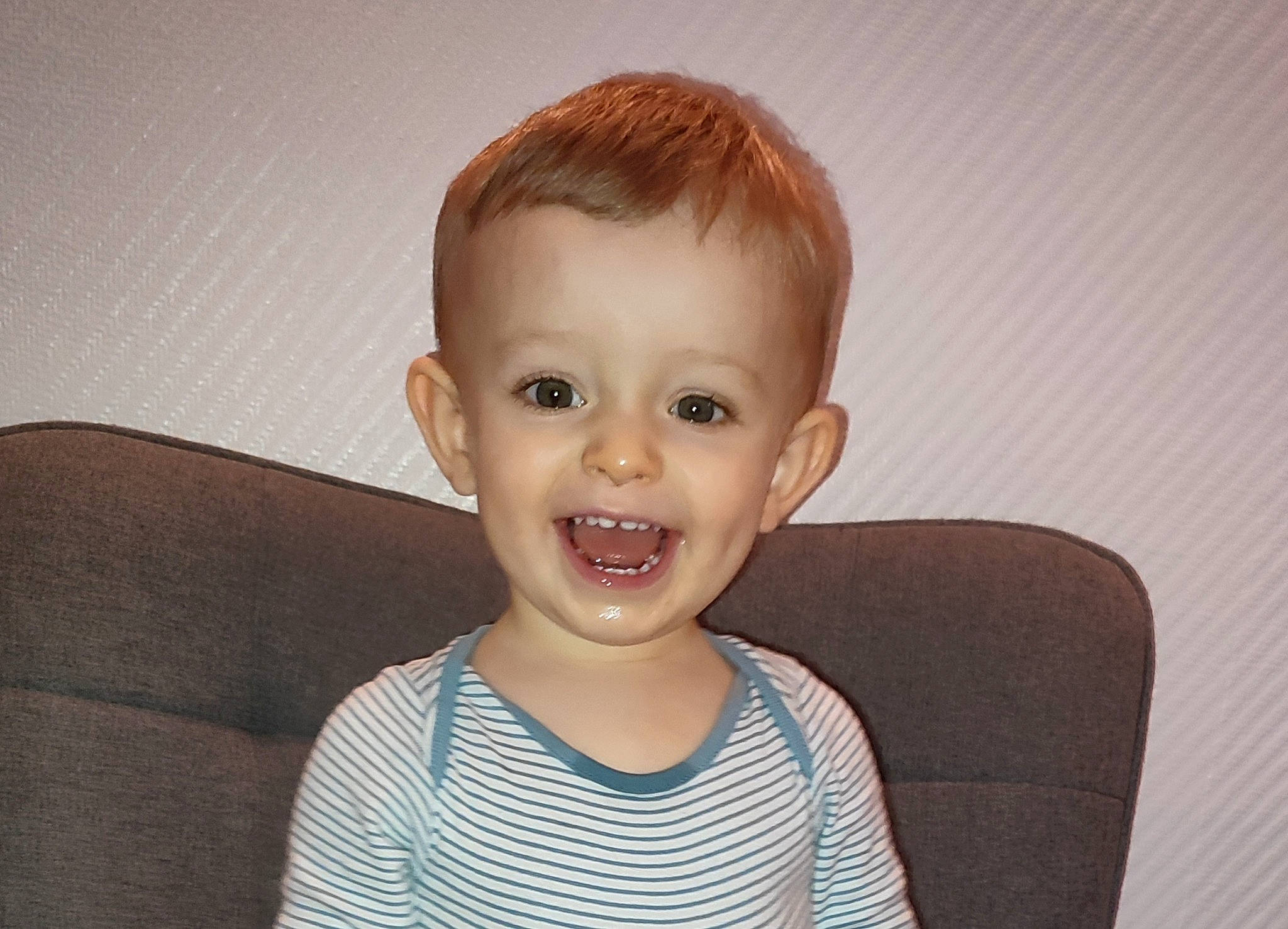 Nolan participe au concours pour gagner de l'argent avec cette photo : arm, baby_toddler_clothing, cheek, clothing, eyelash, flash_photography, happy, human_body, iris, jaw, joy, lip, mouth, neck, nose, person, shoulder, skin, sleeve, smile