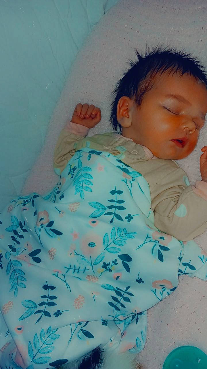 Adelynn Rose is registered to the contest to win money with this photo: azure, baby, baby_sleeping, baby_toddler_clothing, bedding, bedtime, child, comfort, happy, linens, nap, neck, nose, pattern, person, room, sitting, sleeve, t_shirt, textile