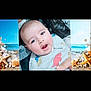 baby, background, beach_theme, child, close_up, clothing, curious, cute, dinosaur_print, expression, face, hair, hand, human, indoor, infant, open_mouth, person, portrait, seashells