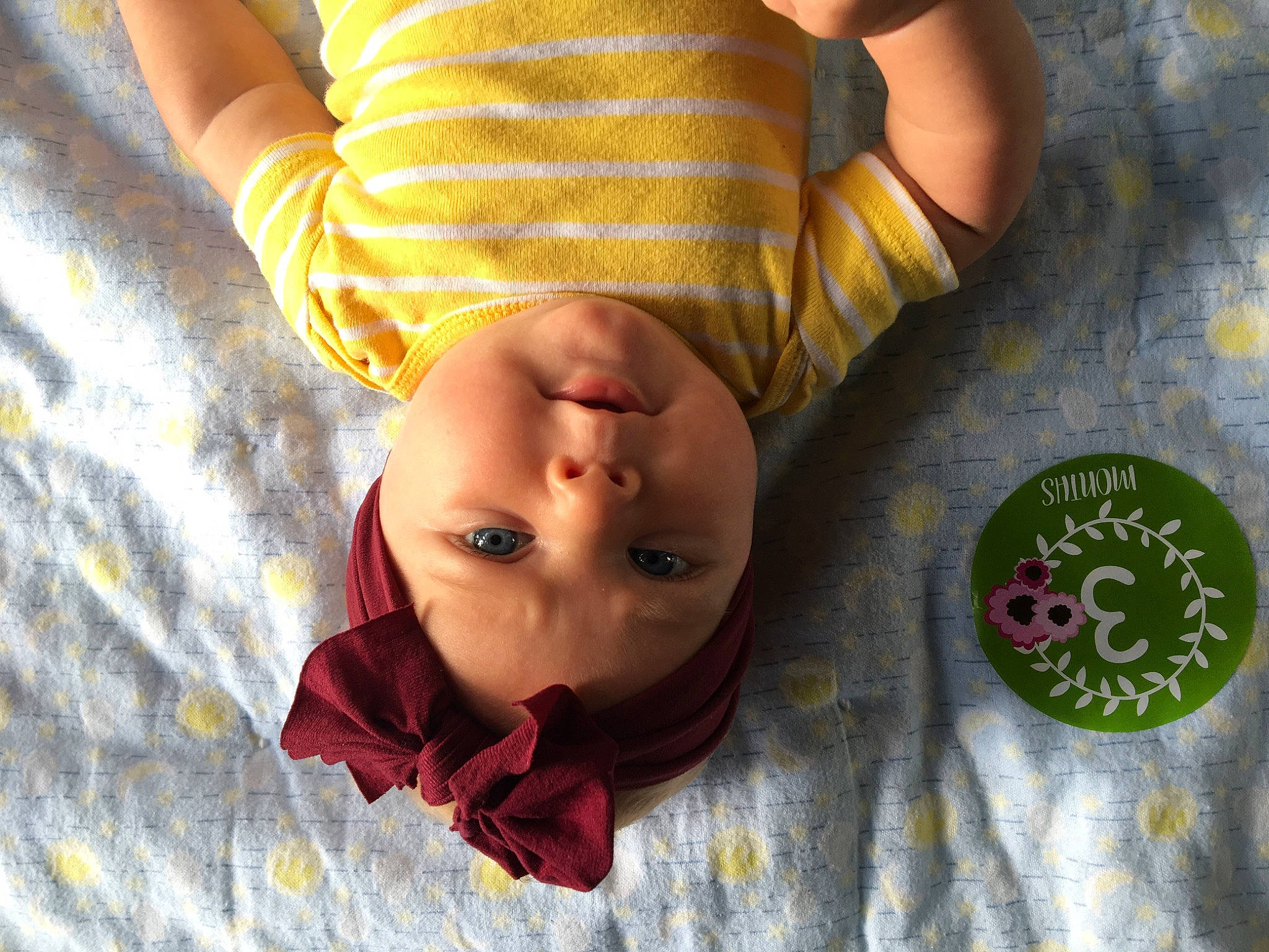 Faye is registered to the contest to win money with this photo: baby, child, hand, person, yellow