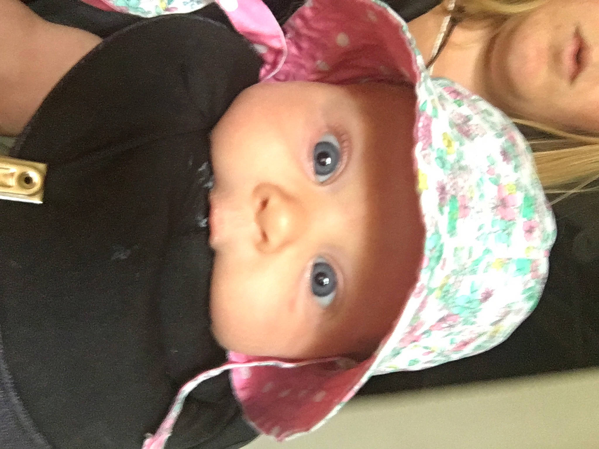 Faye is registered to the contest to win money with this photo: baby, cheek, child, ear, eye, face, head, headgear, headwear, lip, mouth, neck, nose, person, pink, skin, throat, toddler