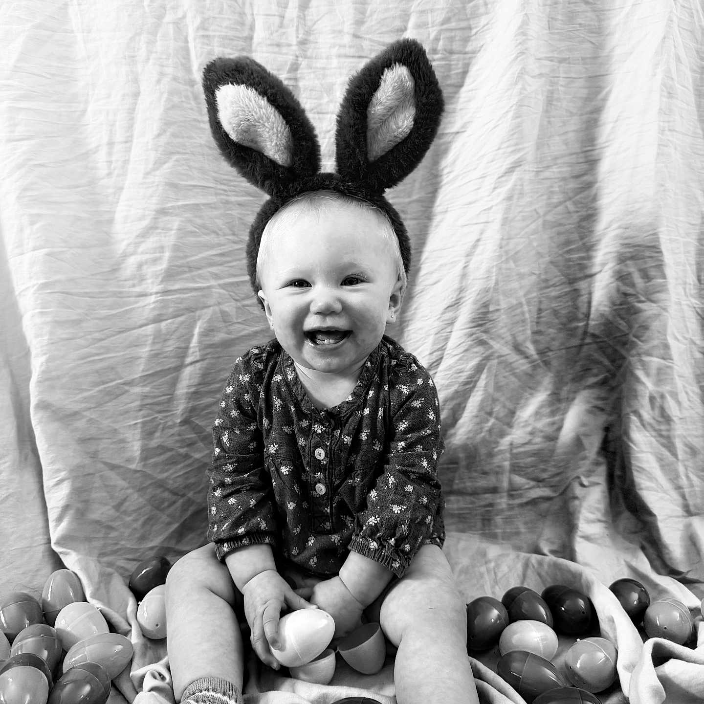 Emma joined the competition — help win amazing prizes! accessories, baby, babylaughing, bodypart, clothing, face, finger, footwear, glove, hand, happy, head, laughing, person, photography, portrait, shoe, sitting, smile, sphere