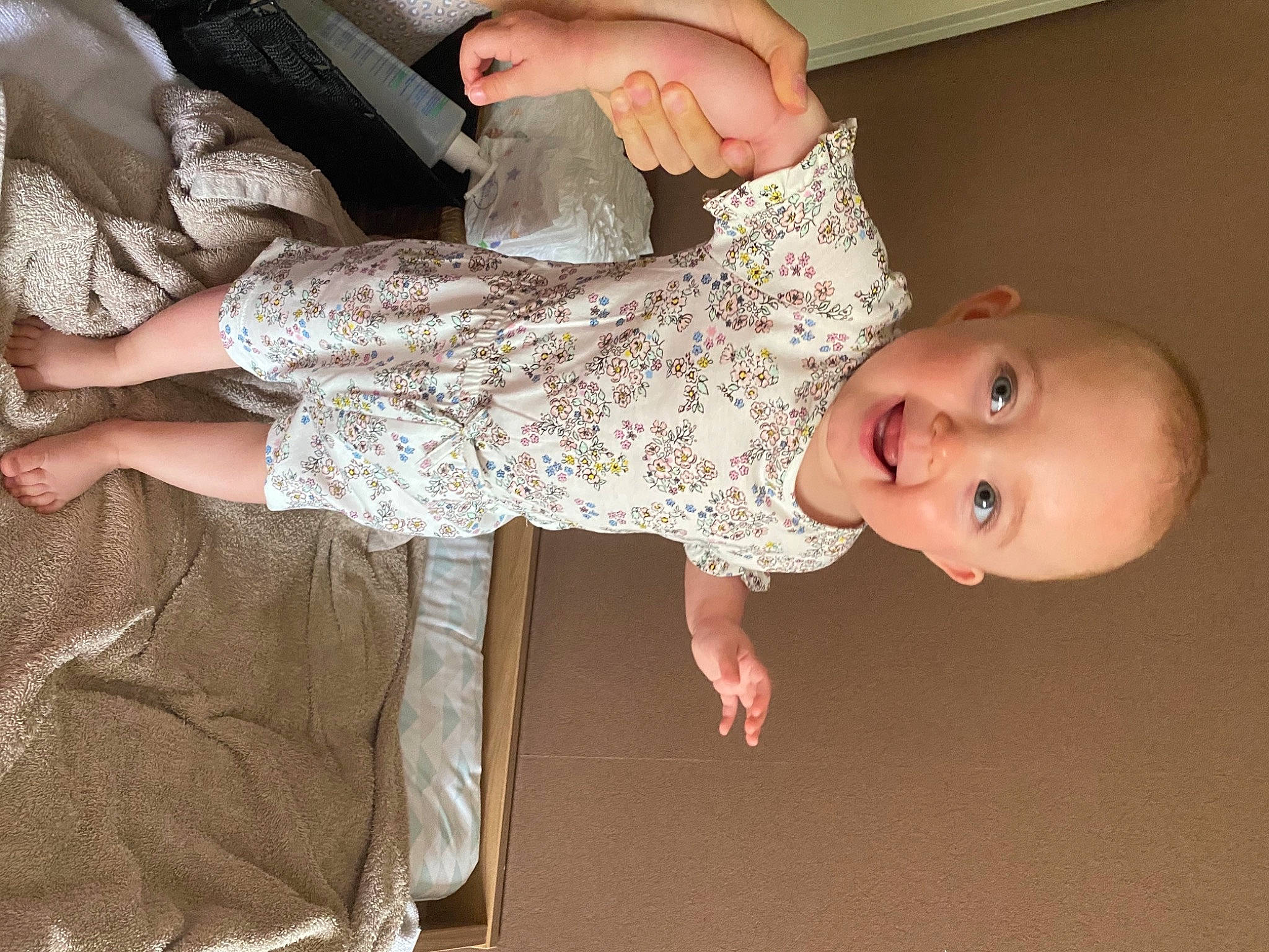 Nelya participe au concours pour gagner de l'argent avec cette photo : arm, baby, baby_toddler_clothing, cheek, dress, finger, flooring, fun, gesture, hand, human_body, human_leg, joint, leg, pattern, person, skin, sleeve, thigh, toddler