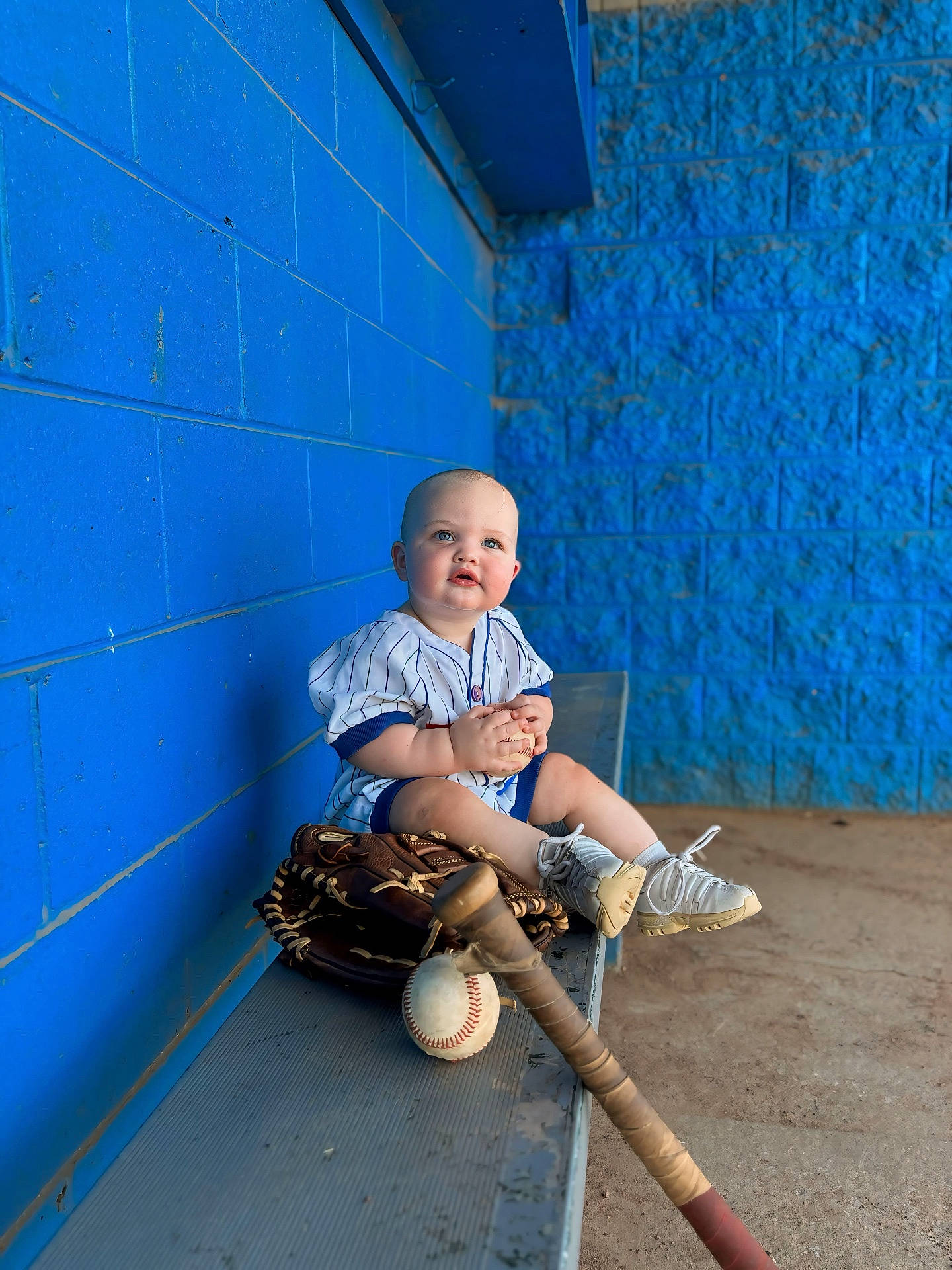 Cash is registered to the contest to win money with this photo: baby, ball, baseball, baseballball, baseballglove, clothing, face, footwear, glove, head, pants, people, person, photography, portrait, shoe, sitting, sport, team, teamsport
