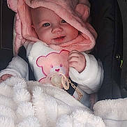 Bianca a rejoint le concours — aidez-le/la à gagner de superbes lots ! baby, bear_ears, blanket, car_seat, child, closeup, cozy, cute, face, hand, happy, indoors, infant, pacifier, pink_hood, portrait, smiling, soft_texture, toddler, warm_clothing