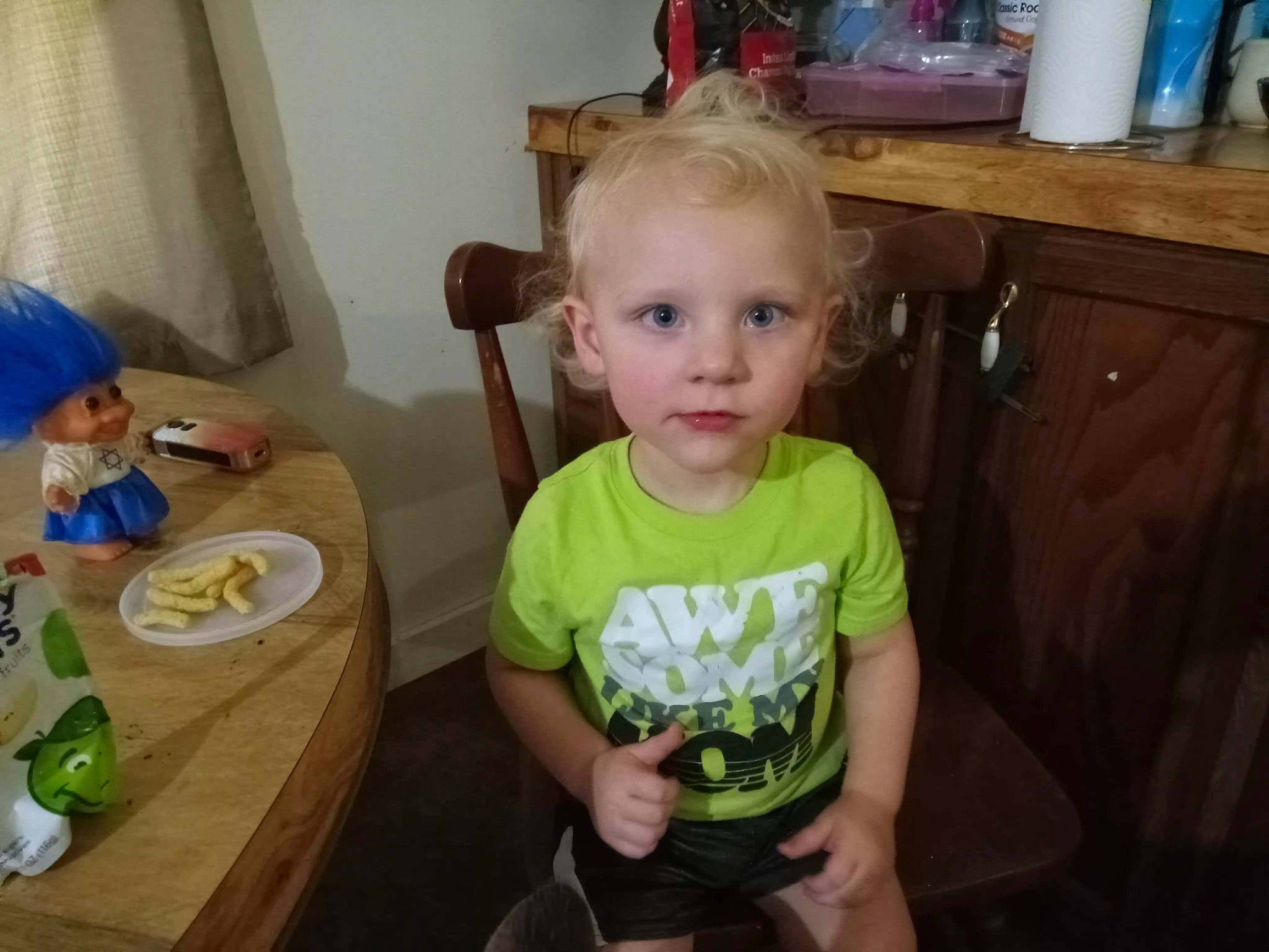 Kysen is registered to the contest to win money with this photo: baby, cabinetry, chair, child, curtain, drawer, event, food, fun, holiday, person, plate, room, sharing, sitting, t_shirt, table, tableware, toddler, toy