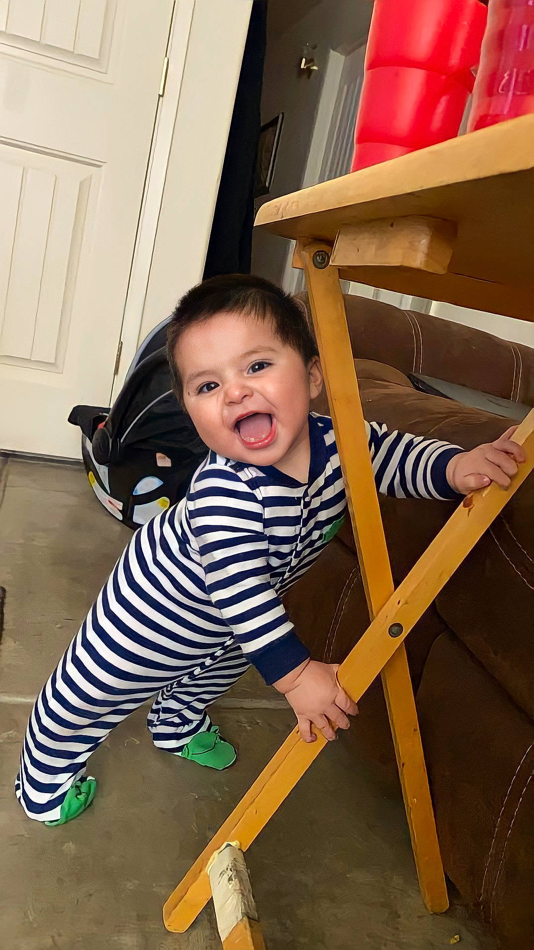 Luciano joined the competition — help win amazing prizes! baby, baby_toddler_clothing, child, door, eye, flooring, fun, happy, hardwood, pattern, person, play, room, sitting, sleeve, smile, t_shirt, toddler, varnish, wood