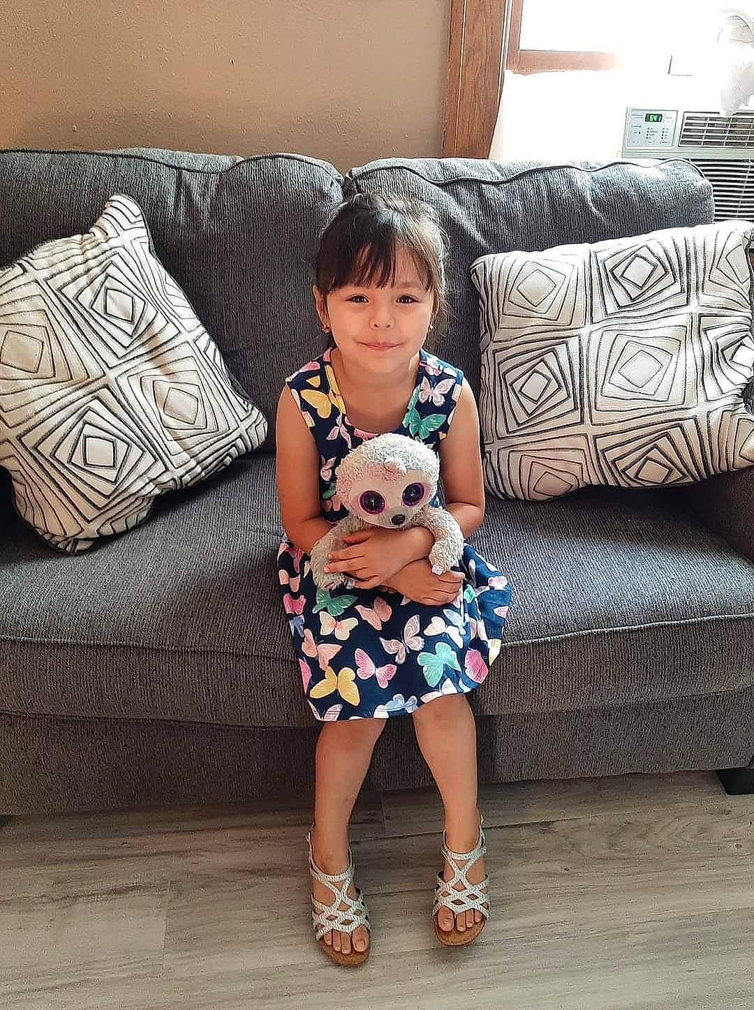 Adriana joined the competition — help win amazing prizes! baby_toddler_clothing, comfort, couch, flooring, furniture, happy, human_body, human_leg, joy, knee, lamp, leg, living_room, pattern, person, pillow, sleeve, sofa_bed, studio_couch, textile