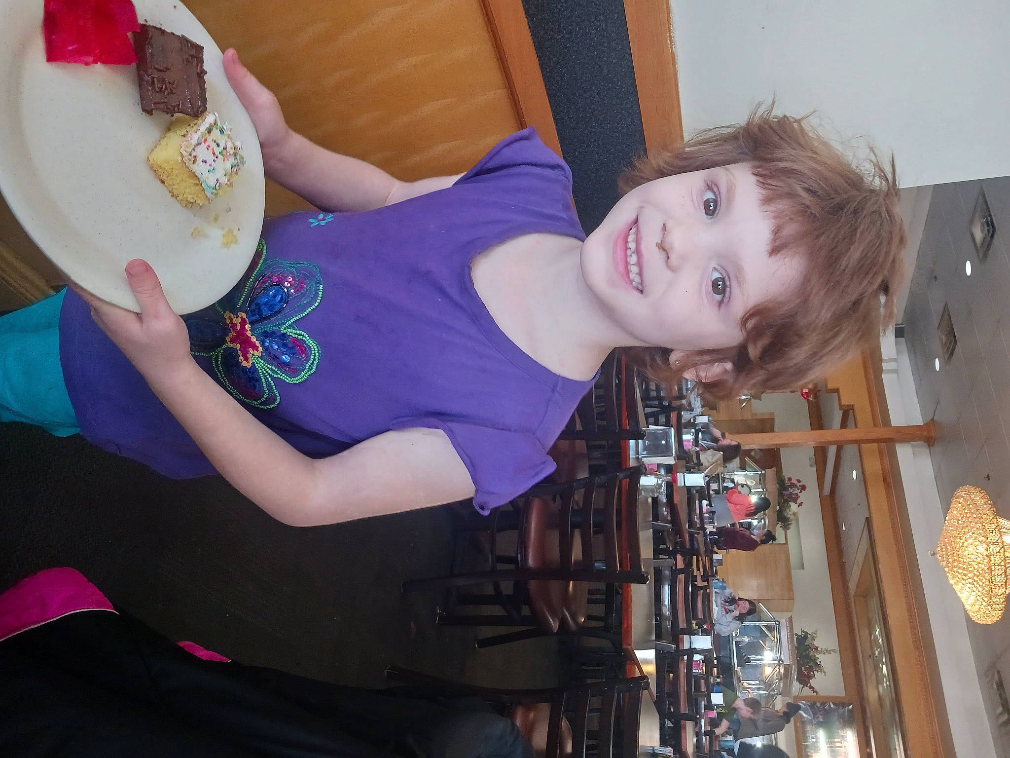 Allison Lute is registered to the contest to win money with this photo: abdomen, child, comfort_food, elbow, food, fun, happy, human_leg, joy, knee, machine, magenta, person, room, smile, t_shirt, tableware, thigh, trunk, waist