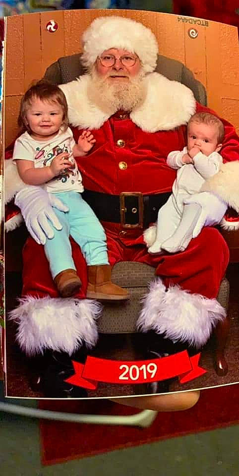 Mason is registered to the contest to win money with this photo: child, christmas, christmas_eve, fictional_character, fur, headwear, holiday, joy, lap, person, santa_claus, toddler