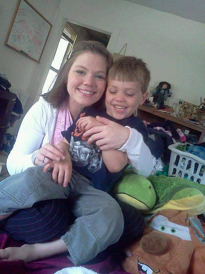 Elric is registered to the contest to win money with this photo: child, happy, hug, joy, people, person, sitting, smile, toddler