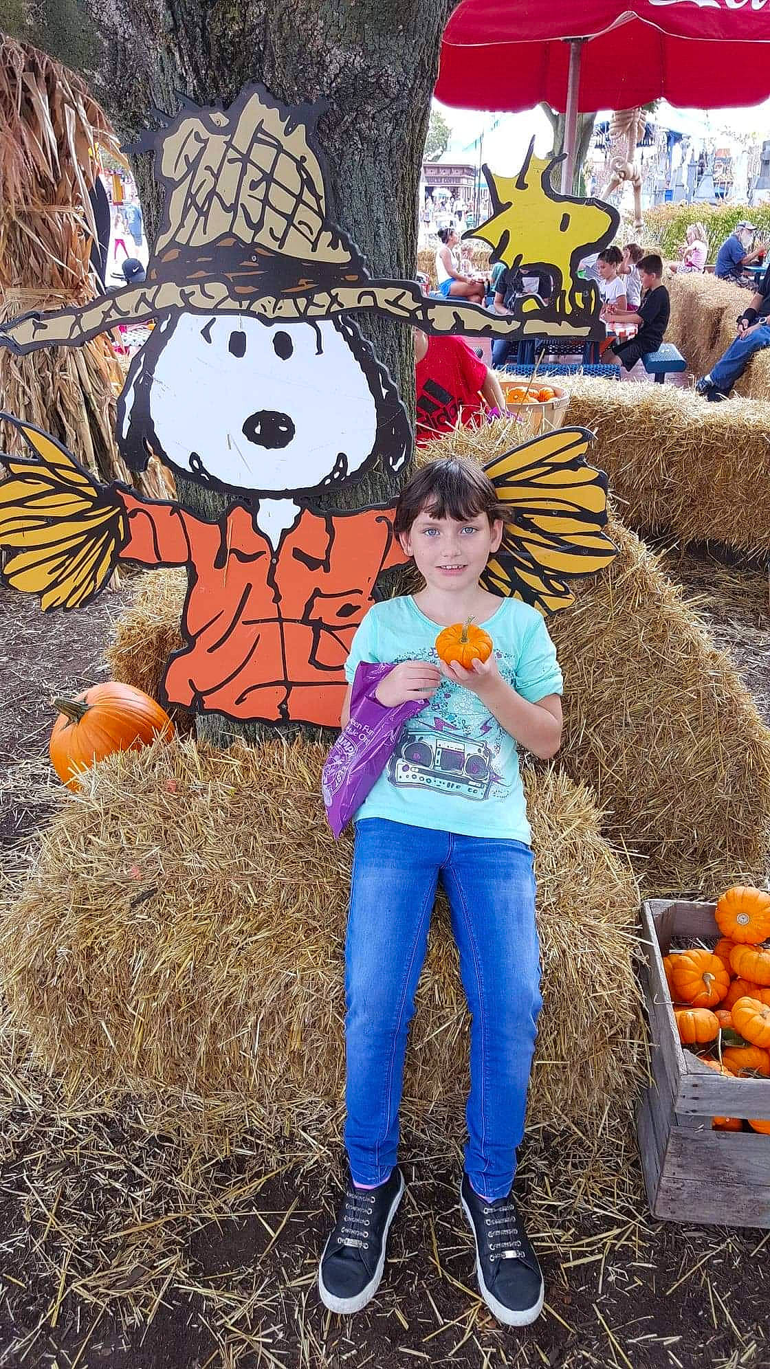 Asha Canterbury joined the competition — help win amazing prizes! agriculture, child, farm, fun, hay, joy, person, plant, pumpkin, scarecrow, straw, winter_squash