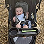 baby, baby_boy, bib, child, clothing, cute, graco, happy, infant, outdoor, person, playground, relaxing, seat, seatbelt, smiling, stroller, sunlight, toy, wood_chips