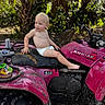 toddler, child, diaper, atv, pink, muddy, outdoor, forest, shoes, clothes, vehicle, nature, greenery, sunlight, adventure, young_child, playful, dirt, seat, exploration