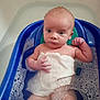 Jackson is registered to the contest to win money with this photo: baby, bath, water, bubbles, blue_bath_seat, towel, infant, skin, wet, foam, small_hand, sitting, curious, bathroom, child, young, indoors, face, head, person