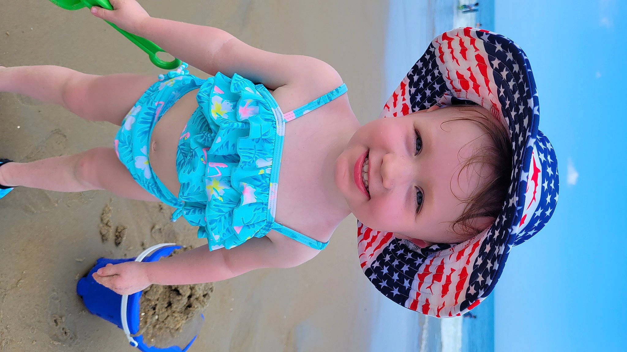 Lilly is registered to the contest to win money with this photo: azure, baby_toddler_clothing, blue, child, electric_blue, event, eye, fun, happy, headgear, human, joy, pattern, person, pink, plaid, skin, smile, textile, toddler