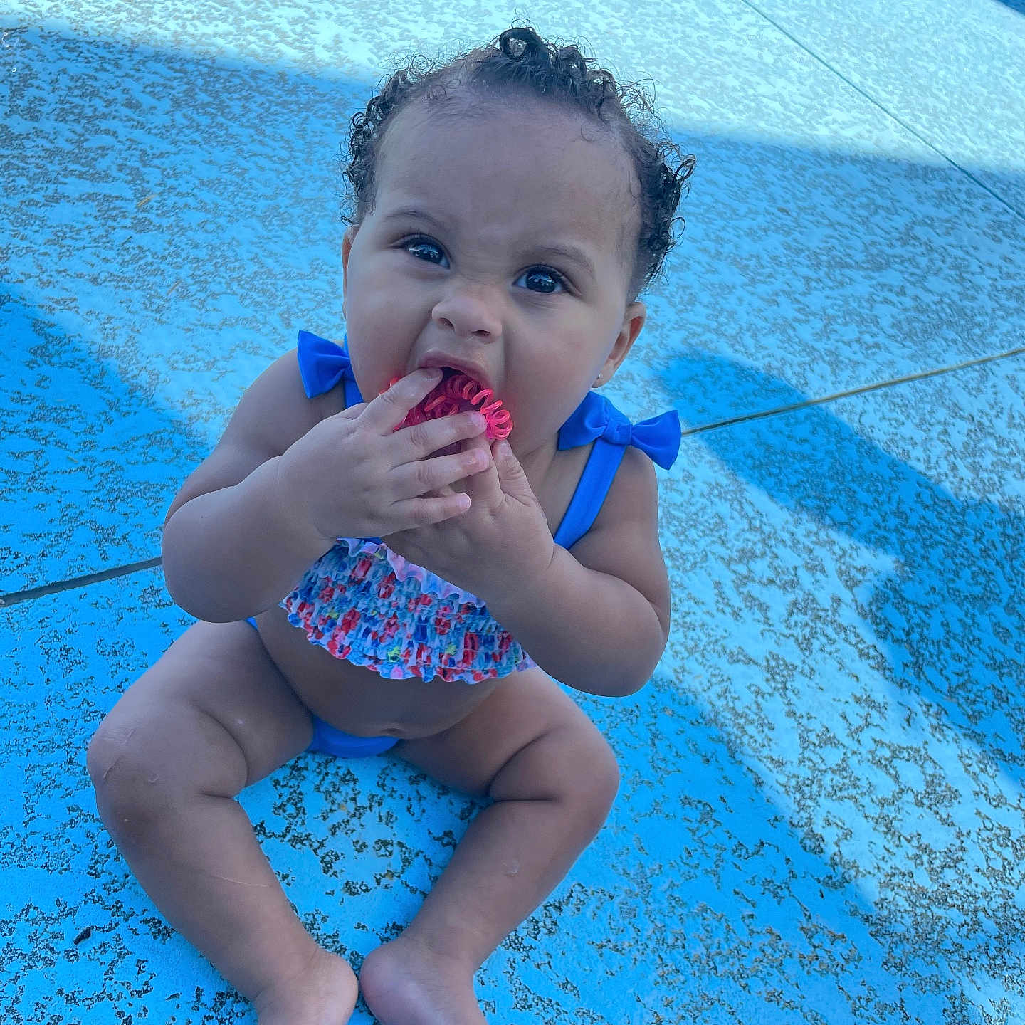 Deja is registered to the contest to win money with this photo: accessories, baby, clothing, cream, cutlery, dessert, eating, face, food, head, icecream, person, photography, pool, portrait, spoon, summer, swimmingpool, swimwear, water