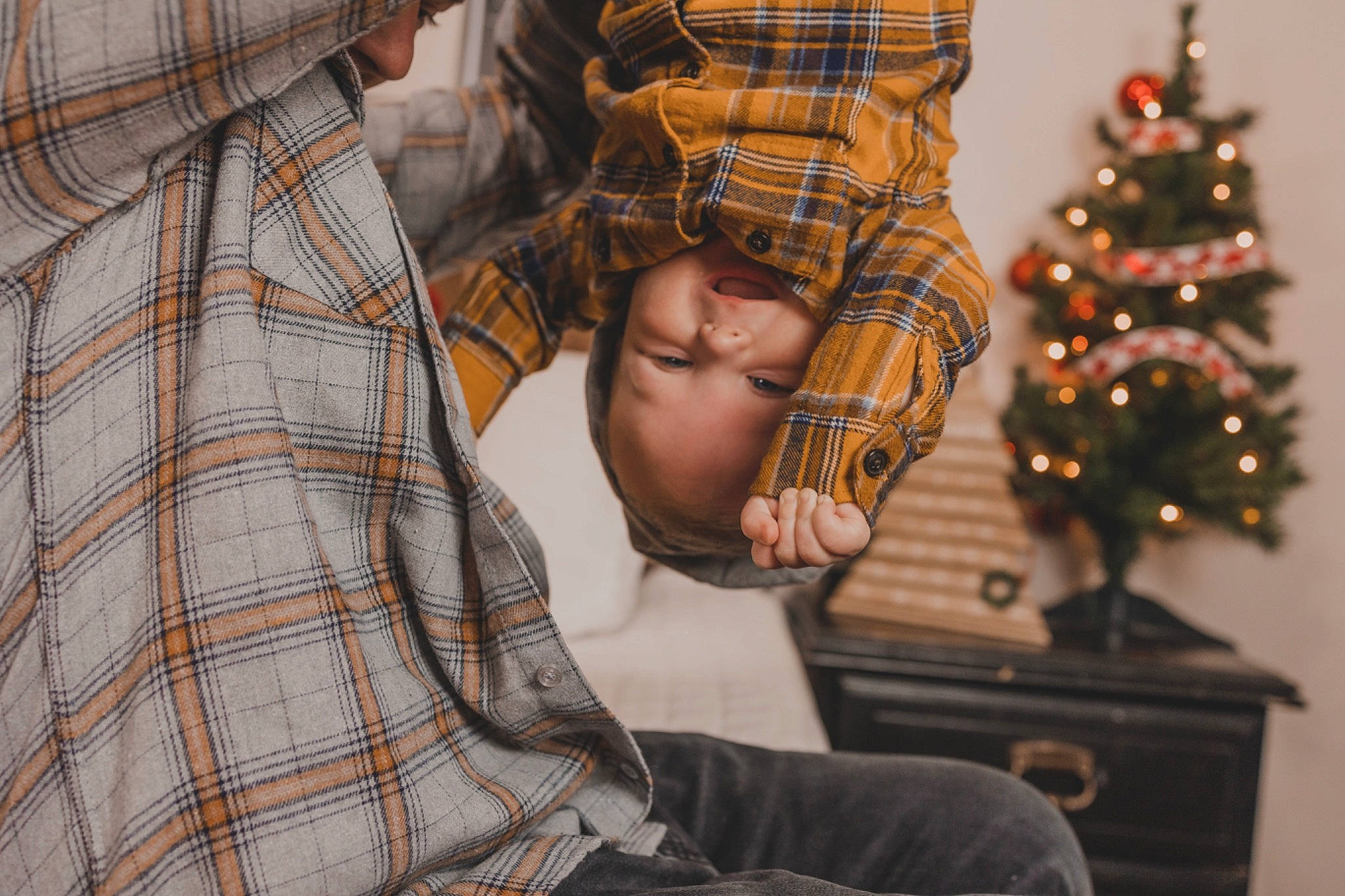 Echo joined the competition — help win amazing prizes! christmas, christmas_decoration, christmas_ornament, christmas_tree, conifer, event, happy, holiday, holiday_ornament, lap, mammal, ornament, pattern, person, plaid, plant, sitting, tartan, toddler, tree