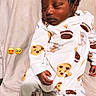 Jamarrion is registered to the contest to win money with this photo: baby, bear_pattern, bed, bedding, blanket, closed_eyes, cute, dark_hair, emojis, face, indoors, infant, newborn, onesie, pajamas, peaceful, photography, portrait, resting, sleeping