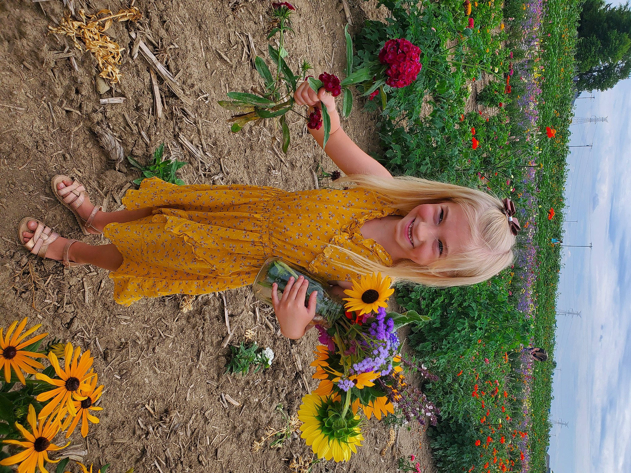 Adalynn is registered to the contest to win money with this photo: annual_plant, asterales, coquelicot, costume, daisy_family, day_dress, floral_design, floristry, flower, happy, joy, mouth, nose, one_piece_garment, people_in_nature, person, petal, photo_shoot, spring, sunflower