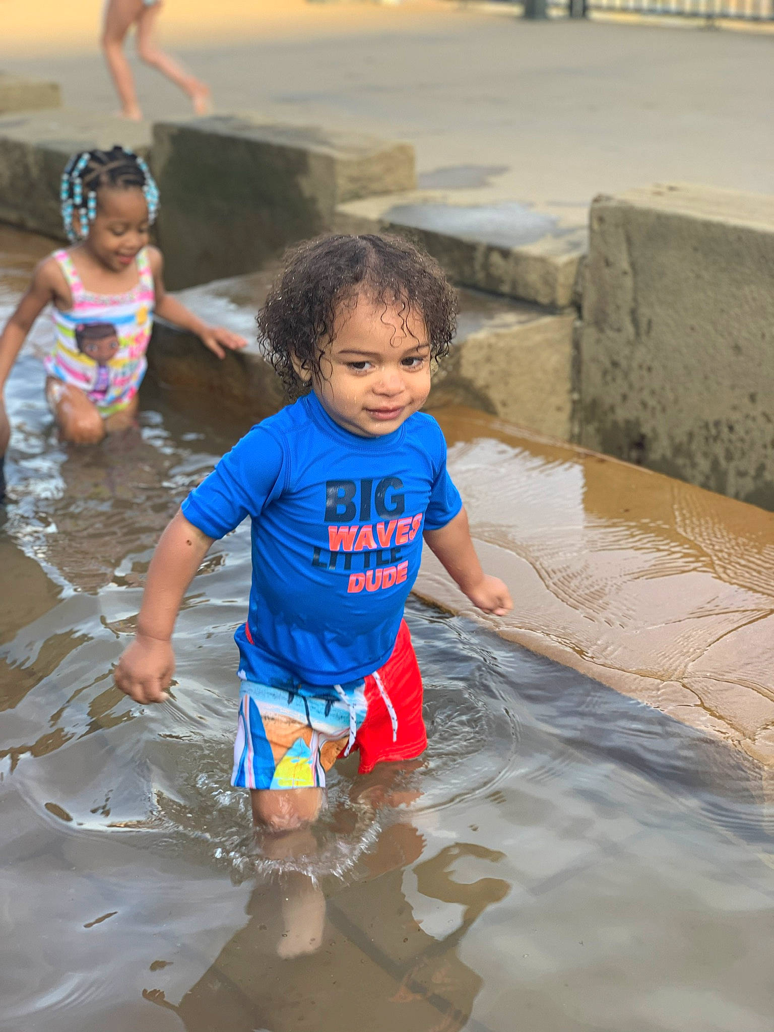 Kayden is registered to the contest to win money with this photo: child, fun, joy, leisure, person, play, puddle, recreation, smile, summer, toddler, vacation, water