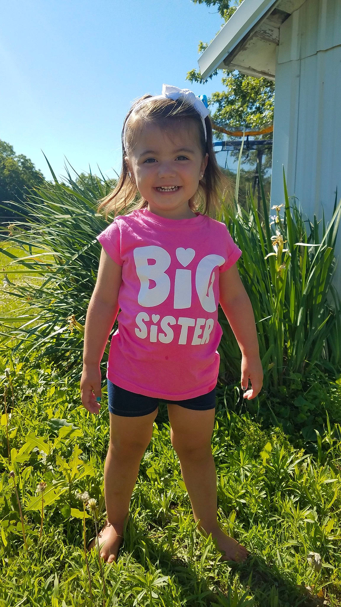 Berklee is registered to the contest to win money with this photo: child, flower, fun, grass, happy, joy, meadow, person, pink, plant, play, shorts, smile, spring, summer, t_shirt, toddler, vacation, wildflower