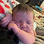 Natalie is registered to the contest to win money with this photo: baby, sleeping, newborn, blanket, hand, face, infant, cozy, indoors, soft_light, peaceful, resting, human, skin, portrait, cute, closeup, child, toddler, relaxation