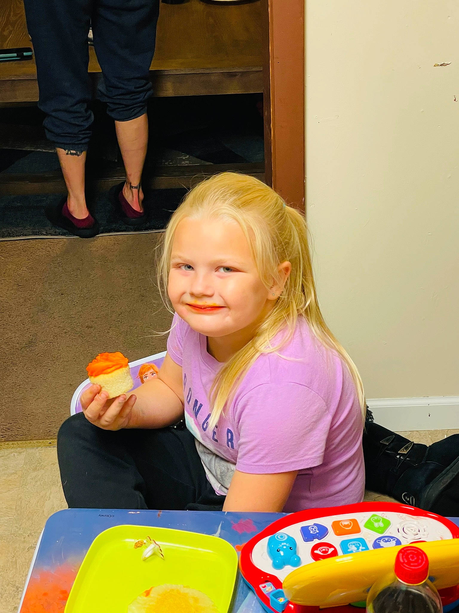 Mia Harnish is registered to the contest to win money with this photo: baby_playing_with_toys, chair, child, event, food, fun, hairstyle, happy, joy, leisure, orange, people, person, plate, sitting, smile, snapshot, summer, table, tableware