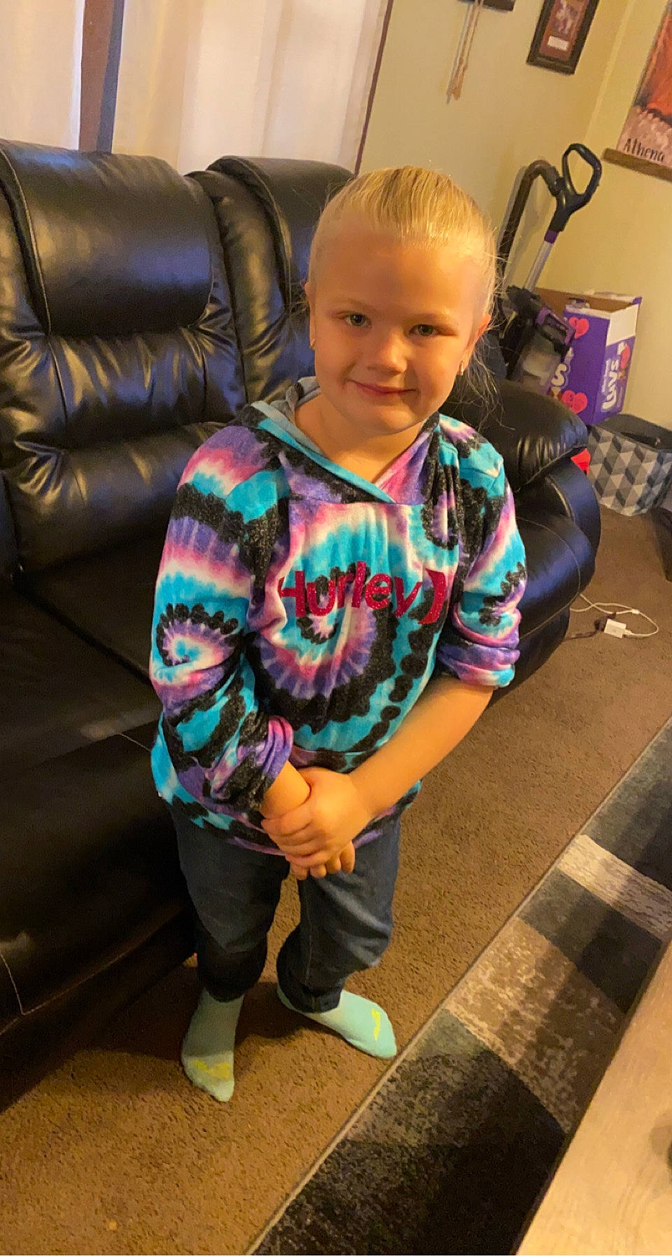 Mia Harnish joined the competition — help win amazing prizes! baby, baby_toddler_clothing, child, comfort, couch, floor, flooring, fun, hairstyle, happy, head, human_leg, joint, joy, leisure, person, sitting, sleeve, smile, sock